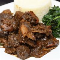Stewed Oxtail · With jasmine rice and sauteed spinach.
