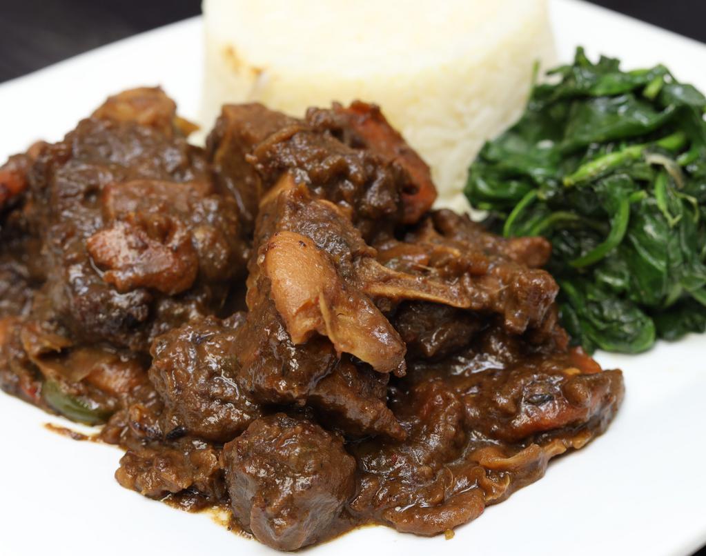 Stewed Oxtail · With jasmine rice and sauteed spinach.