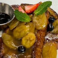 French Toast · Challah bread, cinnamon, orange zest & banana foster compote.