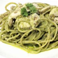 The Pesto Chicken Pasta · Creamy pasta made with chicken, pesto sauce and parmesan cheese on a bed of freshly made pen...