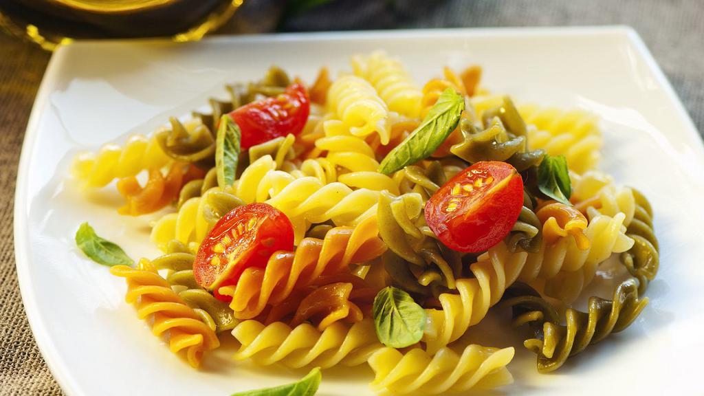 The Tri-Color Pasta · Fresh bowl of pasta with a choice of sauce.