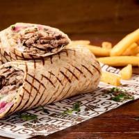 Lamb Secret Shawarma · Thinly sliced lamb and beef mix wrapped in pita bread with lettuce, tomatoes, onions, pickle...