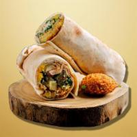 Falafel Fury Wrap · Falafel on a pita with fresh veggies, tahini sauce, rolled and toasted in a panini grill