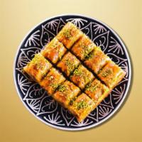 Baklava Delight · A rich dessert pastry composed of layers of flaky dough, filled with chopped nuts and held t...