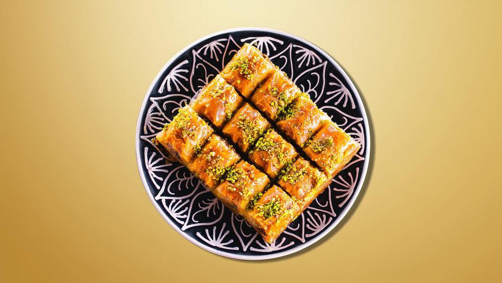 Baklava Delight · A rich dessert pastry composed of layers of flaky dough, filled with chopped nuts and held together with honey.