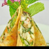 Chilean Sea Bass Spring Roll · Chilean sea bass, scallop, shrimp and vegetable wrapped in crispy spring roll served with pa...