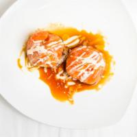 Dumpling · Avocado, wasabi caviar, scallion wrapped with tuna or salmon served with scallion truffle oi...