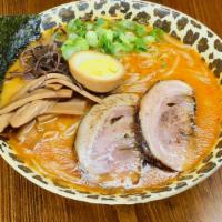 Spicy Sio Ramen · Pork broth with homemade spicy sauce. Salt sauce with roasted garlic seasoning for soup with...