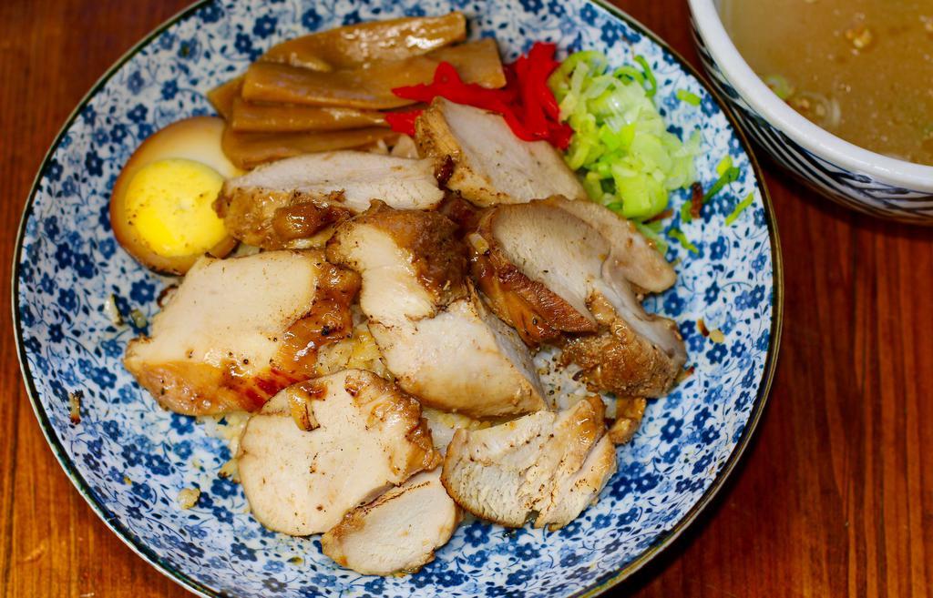 Chickenchashu Don · Sliced free range chicken  charshu over rice. Comes with chicken soup.We recommend reheating at home.