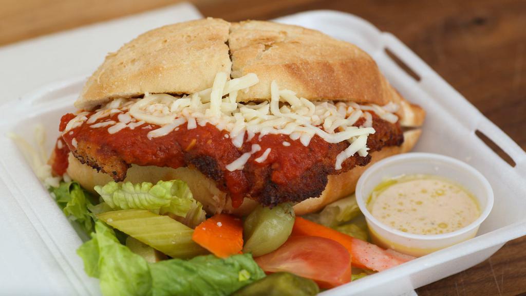 Chicken Alla Parmigiana · Boneless chicken breast lightly breaded with melted mozzarella cheese and tomato sauce.