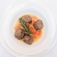 Polpettone Della Nonna · Lamb meatballs in a lemon and rosemary sauce served with marinated fresh tomatoes