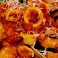 Capellini Tutti Mare · Angel hair pasta with shrimp, little neck clams, calamari in a marechiara sauce