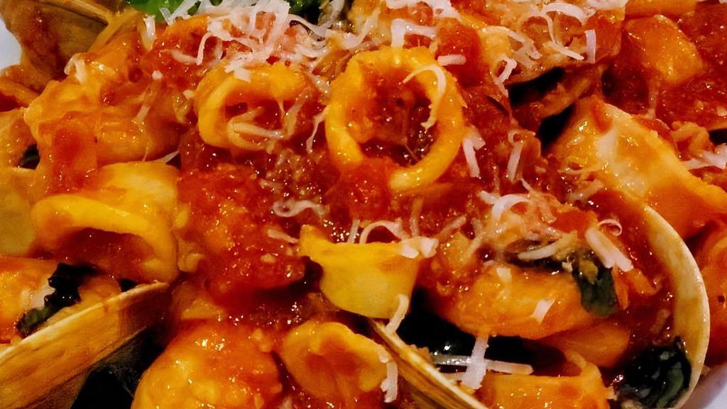 Capellini Tutti Mare · Angel hair pasta with shrimp, little neck clams, calamari in a marechiara sauce