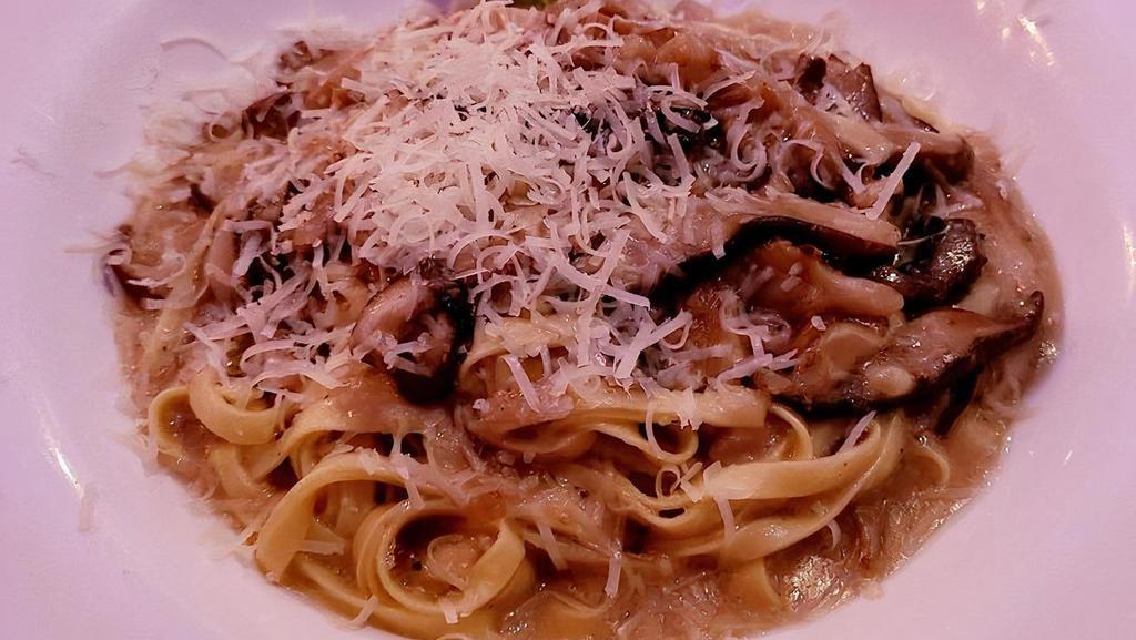 Fettuccine Ai Funghi · Homemade fettuccine pasta with mushrooms and truffle oil