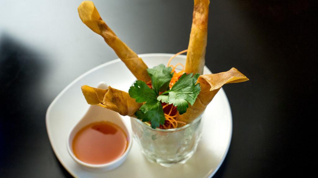 Crispy Spring Roll · Deep fried rolls stuffed with vermicelli and vegetables served with sweet chili sauce.