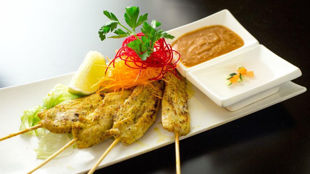 Grilled Chicken Sate · Grilled marinated chicken skewers served with peanut sauce and cucumber sauce.