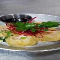 Kanom Jeep Shrimp Dumplings · Steamed minced shrimp wrapped in wonton skin, served with vinaigrette sauce.