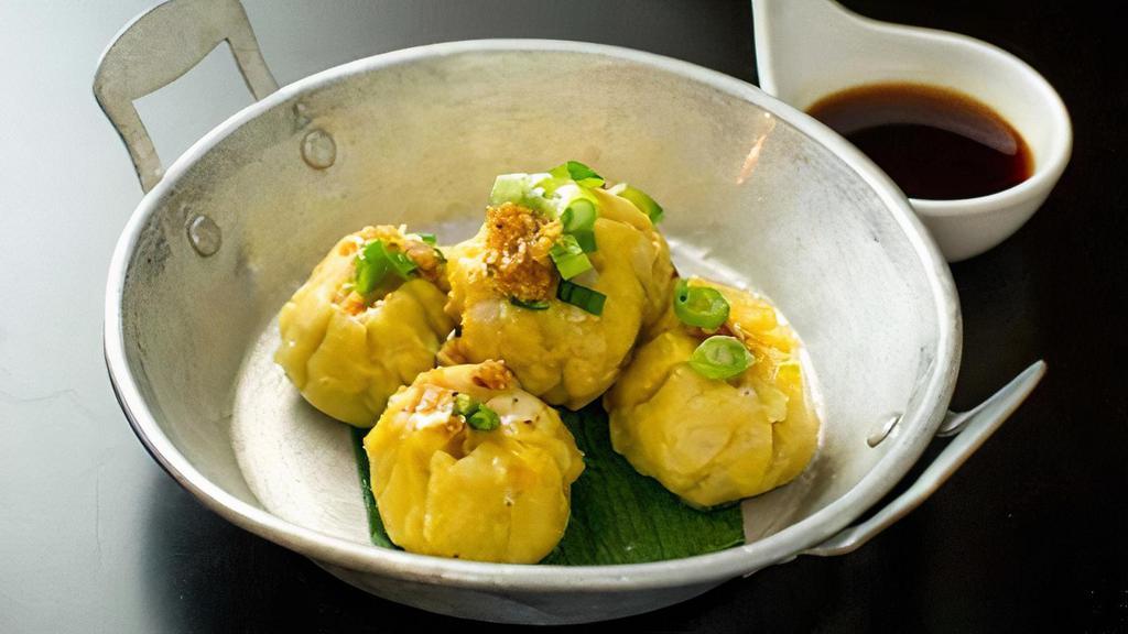 Steamed Chicken Dumplings · Steamed minced chicken wrapped in wonton skin served with vinaigrette sauce.