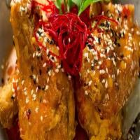 Fried Chicken Wings · Deep fried secret recipe chicken Thai style topped with house sweet chili sauce.