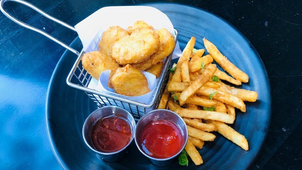 9 Chicken Nuggets · Home made chicken nuggets served with Thai sweet chili sauce, ketchup and french fries.