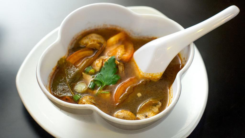 Tom Yum Soup · Hot. Spicy. Spicy and sour soup seasoned with Thai herbs, mushrooms, lemongrass, and kaffir lime leave.