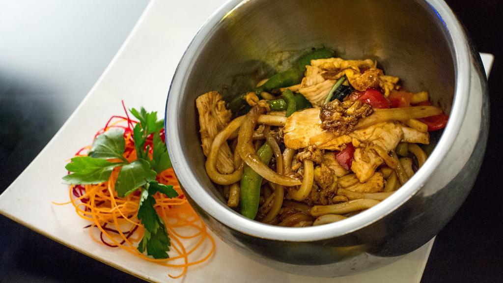 Spicy Pad Udon · Hot. Spicy. Stir fried udon noodle in spicy yummy sauce with onions, scallion, fresh basil, bell peppers and egg.