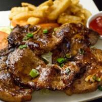 Pork Chop Steak With Black Pepper Sauce · Grilled marinated pork chop topped with homemade black pepper sauce served with green salad ...