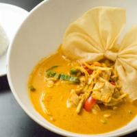 Red Curry · Hot. Spicy. Spices cooked in red chili paste with bamboo shoots, fresh basil and bell pepper...
