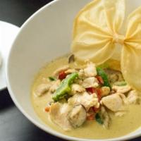 Green Curry · Hot. Spicy. Spices cooked in green chili paste with eggplants, and bell peppers fresh basil....