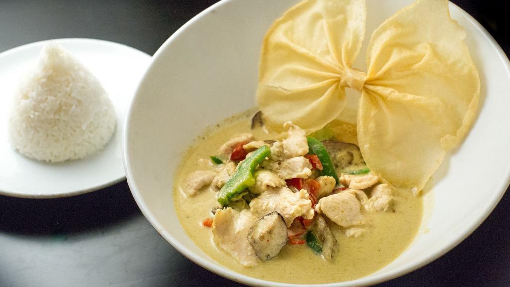 Green Curry · Hot. Spicy. Spices cooked in green chili paste with eggplants, and bell peppers fresh basil. Simmered in coconut milk.