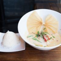 Panang Curry · Hot. Spicy. Spices cooked in panang curry paste with string beans, bell peppers, and kaffir ...