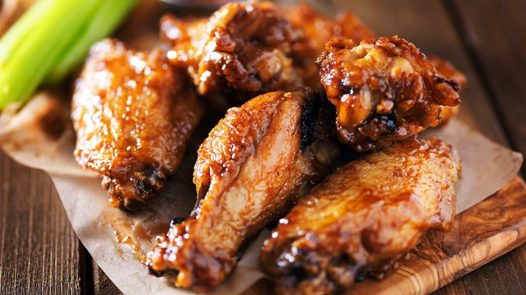 Chicken Wings · Fresh chicken wings smothered in choice of sauce.