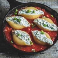 Stuffed Shells · Fresh made shells filled with creamy cheese and spinach mix.