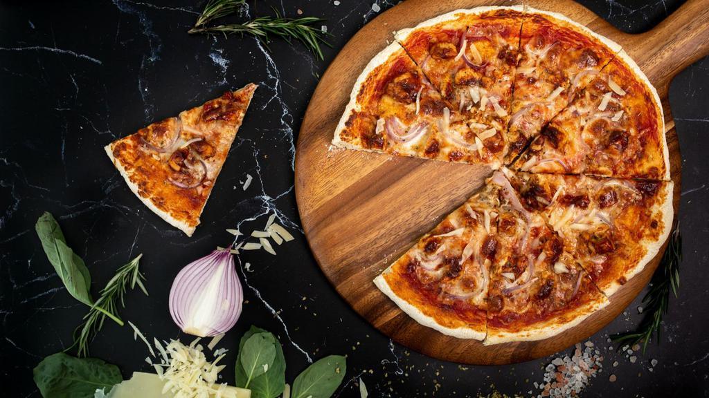 Bbq Chicken Pizza · Barbecue chicken smothered in bbq sauce, red onions, and melted cheese.