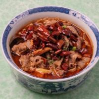 Braised Beef In Red Soup 红汤肥牛 · Braised beef, wood's ears, cabbage, glass noodles, dried tofu skin, chili peppers, Sichuan p...