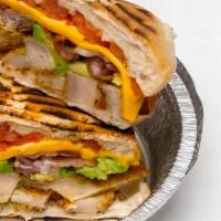 Chicken Club Panini · Grilled chicken with smoked bacon, lettuce, tomatoes, and mayonnaise.