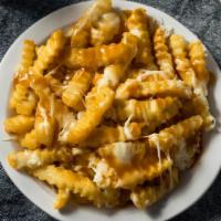 Disco Fries  · Crispy fries mixed with gravy and cheese.