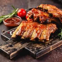 Bbq Ribs  · Tender, juicy ribs topped with a BBQ sauce and served with  french fries on the side.