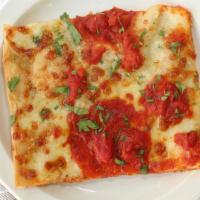 Grandma Style Siciliana Pizza (8 Slices) · Thin crust with fresh basil, regular marinara sauce, and parmesan.