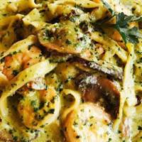 Pasta With Pesto Sauce · Basil, pinoli, and cheese served with bread.