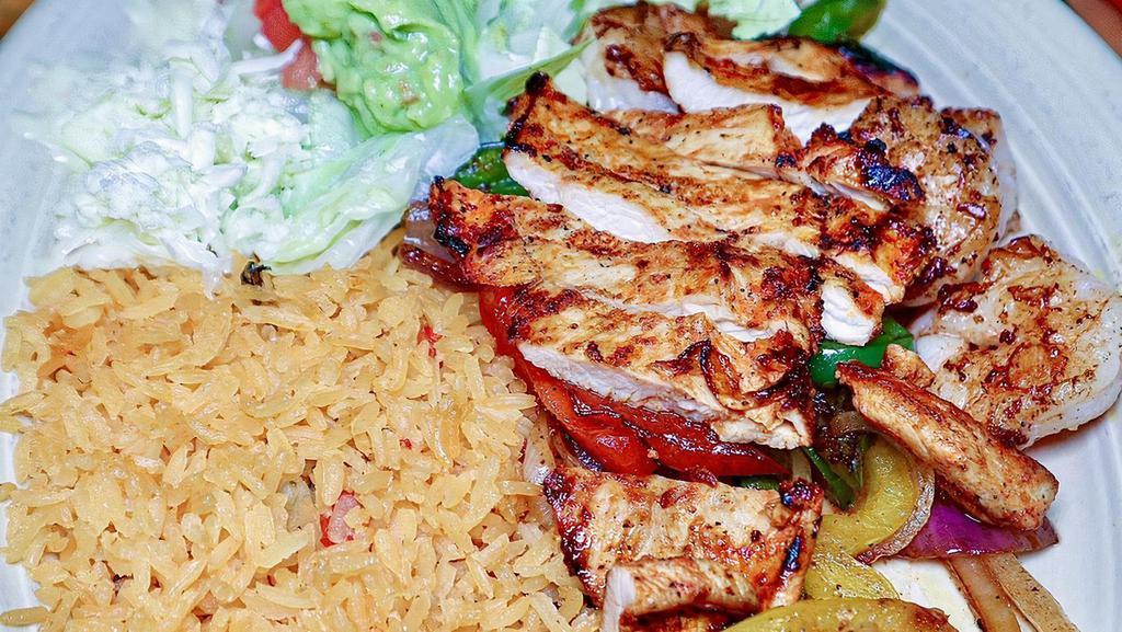 Las Brochetas · Six large shrimp grilled on skewer with onions, chicken and bell peppers. Served with Mexican rice, sour cream, guacamole, shredded cheese, lettuce and tomatoes.