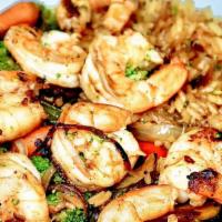 Camarones Con Arroz · Gluten free. Marinated shrimp sauteed with peppers, mushrooms, onions, squash, carrots, caul...