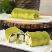 Matcha Crepe Roll · Matcha crepe wrapped with match sauce, whipped cream, and red beans.