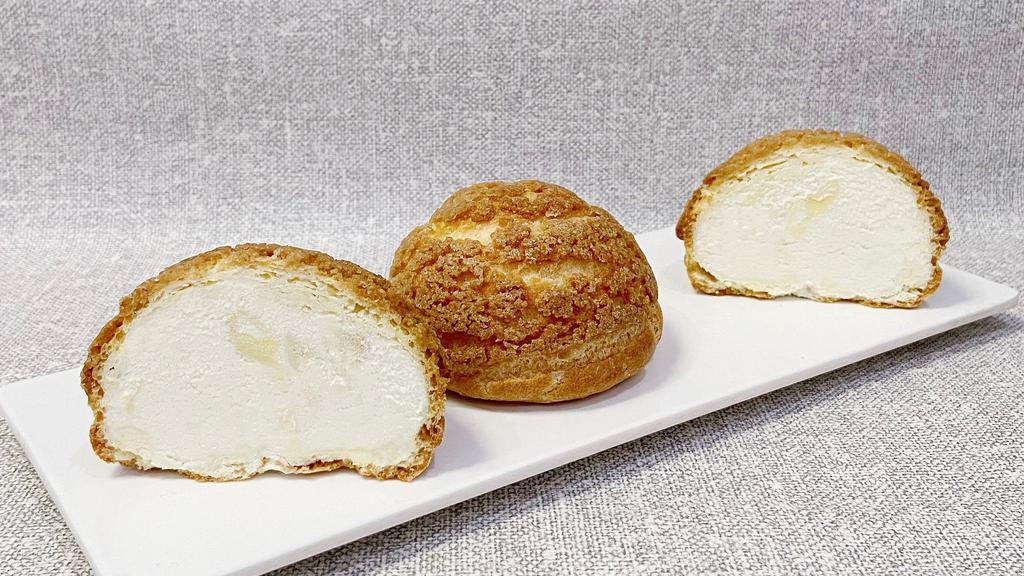 Musang King Durian Cream Puff · Freshly baked puff with creamy durian fillings.