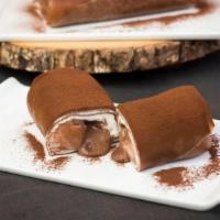 Coco Crepe Roll · Coco crepe wrap with caramel chocolate crunch chocolate sauce, and whipped cream.