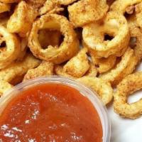 Fried Calamari · With a lemon wedge, marinara or tossed in our buffalo sauce served with blue cheese.