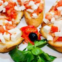 Bruschetta Crostini · Chopped tomatoes, garlic, basil, olive oil on toasted Italian bread.