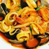 Capellini Seafood · Fresh mussels, clams , four shrimp ,jumbo scallops over 
Angel  hair pasta. In a light red s...
