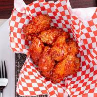 Wings Of Fire · Our BB wings are tossed with our hot spicy sauce.