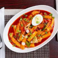 Ddeok Bokki · Rice cake, fishcake, and cabbage with sweet and spicy chili sauce.